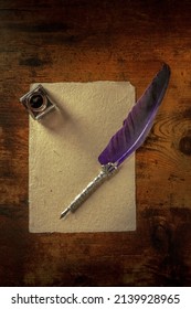 A Quill Pen With A Vintage Ink Well And A Piece Of Old Paper, Overhead Flat Lay Shot