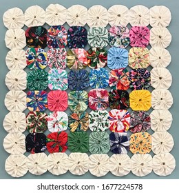 Quilt Button Style Yo Yo Flower Vintage Pattern In Colorful Fabric Arrangment