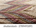 A quilt made using the patchwork technique.