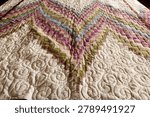 A quilt made using the patchwork technique.