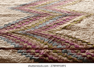 A quilt made using the patchwork technique.