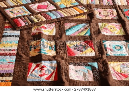 A quilt made using the patchwork technique.