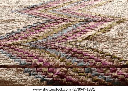 A quilt made using the patchwork technique.