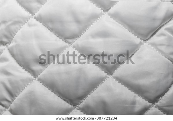 quilted fabric texture of white color for\
hammering, backgrounds and\
textures
