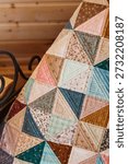 Quilted patchwork quilt closeup. Vertical