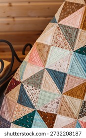 Quilted patchwork quilt closeup. Vertical