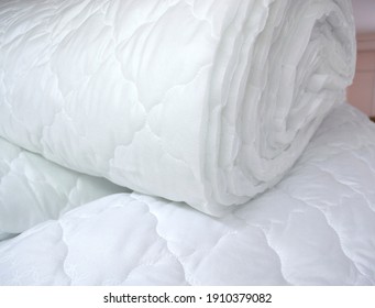 Quilted Polyester And Cotton Fabric For The Production Of Pillows, Blankets, Bed Mattresses. Sintepon, Artificial Down, Siliconized Fiber For Light Industry And Garment Production Of Home Textiles