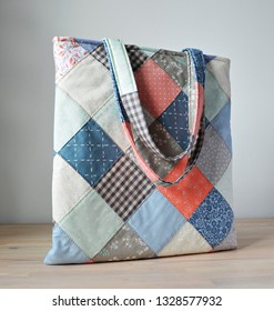 Quilted Tote Bag On The Wooden Table