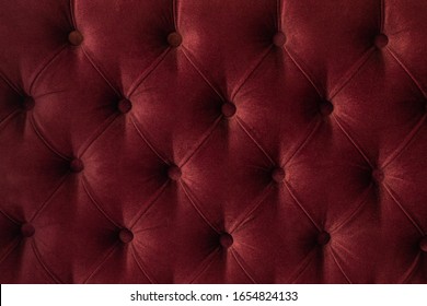 Quilted Velour Buttoned Burgundy Red Color Fabric Wall Pattern Background. Elegant Vintage Luxury Sofa Upholstery. Interior Plush Backdrop