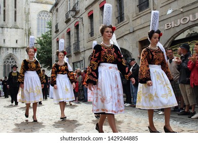 Quimper, Brittany France- July 28, 2013 : Traditional costume and hats - coiffe bigoudene. The annual Festival de Cornouaille  in the city of Quimper. 
