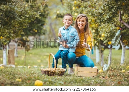 Similar – Image, Stock Photo Little girl woman carrying wicker basket with fresh organic apples