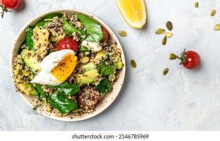 Quinoa Buddha Bowl With Avocado, Egg, Tomatoes, Spinach And Sunflower Seeds On A Light Background. Homemade Food. Healthy, Clean Eating. Vegan Or Gluten Free Diet, Long Banner Format. Top View