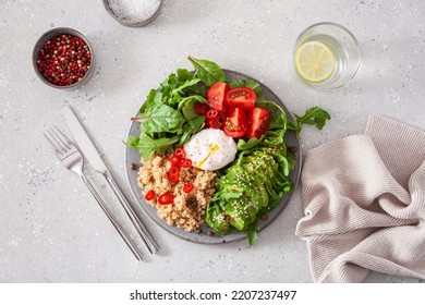 Quinoa With Poached Egg, Avocado Tomato Salad Leaves. Healthy Vegetarian Lunch Breakfast