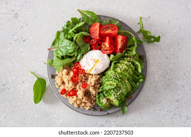 Quinoa With Poached Egg, Avocado Tomato Salad Leaves. Healthy Vegetarian Lunch Breakfast