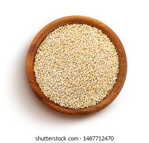 Quinoa seeds in wooden bowl isolated on white background with clipping path, top view