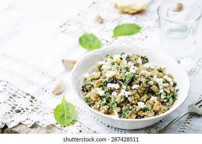 Quinoa Spinach Eggplant Feta Salad On A White Background. The Toning. Selective Focus