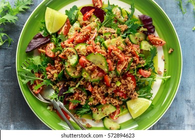 Quinoa Tabbouleh Salad With Tomatoes, Cucumber Green Onion. Concept Healthy Food