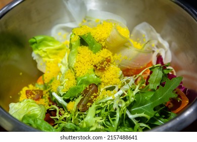 Quinoa Tabouleh Salad In A Bowl Sitting On A Wooden Table.