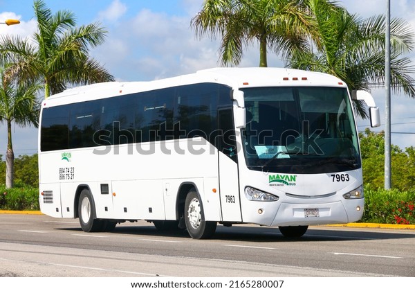 Quintana Roo, Mexico - May 16, 2017:\
White touristic coach bus Irizar at an intercity\
road.