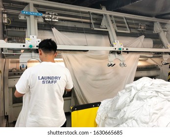 Quintana Roo, Mexico-January 21, 2020: Commercial Laundry Onboard The Cruise Ship Norwegian Breakaway.  Image Shows A Large Sheet Folding Machine.