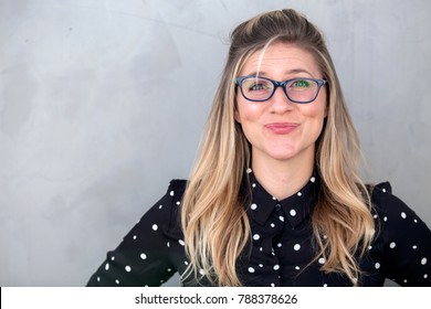 Quirky Silly Funny Expression Portrait Of Offbeat Unfashionable Woman In Glasses