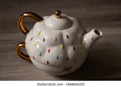 Quirky teapot with dots and golden handles - Shutterstock ID 1468666253