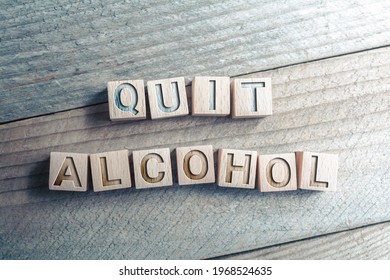 Quit Alcohol Written On Wooden Blocks On A Board - Reminder Concept