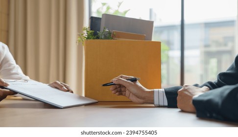 Quit Job Business man sending resignation letter and packing Stuff Resign Depress or carrying business cardboard box in office. Change of job or fired from company - Shutterstock ID 2394755405