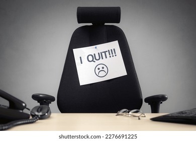 I quit resignation note on empty business chair in office concept for resigning, give up and leaving job