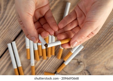 Quit Smoking Cigarette Concept. The Woman Quits Smoking Cigarettes. Quit Bad Habit, Health Care Concept. No Smoking.