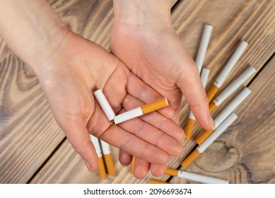 Quit Smoking Cigarette Concept. The Woman Quits Smoking Cigarettes. Quit Bad Habit, Health Care Concept. No Smoking.