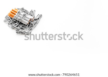 Quit smoking. Cigarettes in chains on white background top view space for text