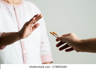 Quit smoking, no tobacco day, mother hands gesture reject proposal the cigarette, selective focus