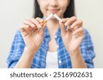 Quit, stop smoking, addiction asian young woman, girl refusing cigarette, smoker quitting smoke, hand in broken, break tobacco. Quit bad habit, health care concept. Willpower lifestyle of people.