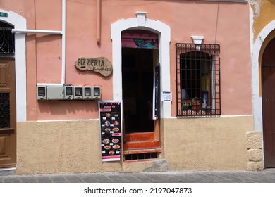 QUITO, ECUADOR - APRIL 14, 2022: Pizza Restaurant In A Historic Building In The Old Town 