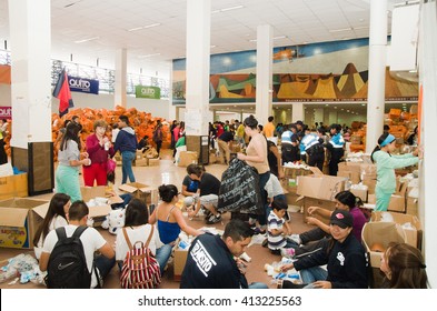 Quito, Ecuador - April 23, 2016: Unidentified Citizens Of Quito Providing Disaster Relief Food, Clothes, Medicine And Water For Earthquake Survivors In The Coast