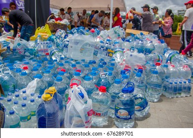 Quito, Ecuador - April,17, 2016: Unidentified Citizens Of Quito Providing Disaster Relief Water For Earthquake Survivors In The Coast