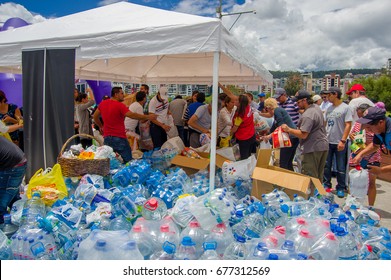 Quito, Ecuador - April,17, 2016: Unidentified Citizens Of Quito Providing Disaster Relief Water For Earthquake Survivors In The Coast