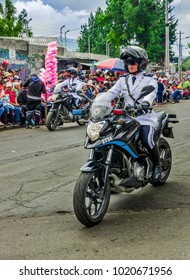 Quito, Ecuador - January 31, 2018: Unidentified people wearing a police uniform and driving a motorcycles during a parade in Quito, Ecuador