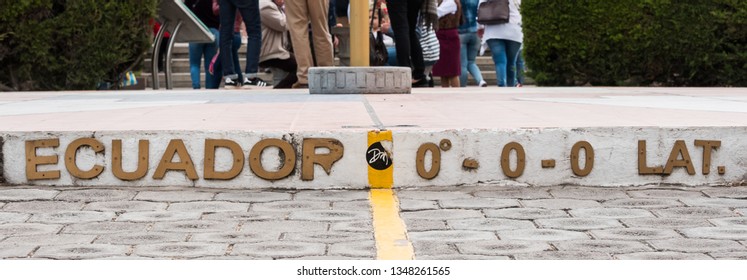 QUITO, ECUADOR - JULY 29, 2018: A Yellow Line Painted On The Ground Showing The Zero Degree Latitude And Longitude Coordinates.