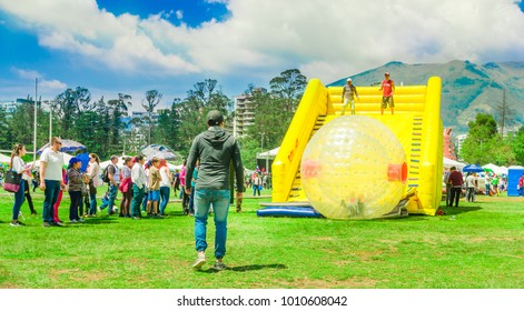 QUITO, ECUADOR - NOVEMBER 28, 2017: Outdoor View Of Unidentified Young People Inside Of Giant Inflatable Transparent Ball Over A Plastic Slide In The Carolina Park During A Festival In The City Of