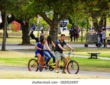 Quito, Ecuador - September 26, 2015: Park El Ejido In Quito, Capital Of Ecuador. Young People Ride Together Bicycle At Park 