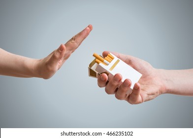 Quitting smoking concept. Hand is refusing cigarette offer. - Shutterstock ID 466235102