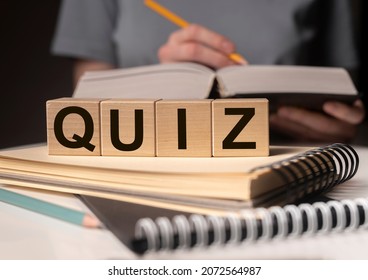 Quiz Or Quizz Concept. Word On Wood Cubes.