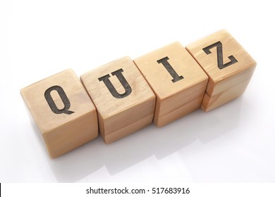 QUIZ word made with building blocks isolated on white - Shutterstock ID 517683916