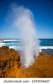 Quobba Blow Holes. Marine geyser formed as sea caves grow landwards and upwards into vertical shafts. Hydraulic compression of water that is released through a port from the top of the blowhole.
