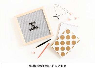 Quote Back to school. Flatlay of letterboard, glasses, stationery, notepads on white desk - Powered by Shutterstock