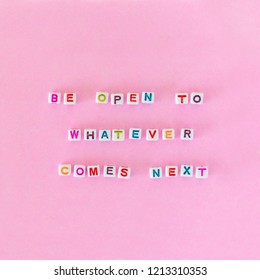 Quote "Be open to whatever comes next" made out of beads