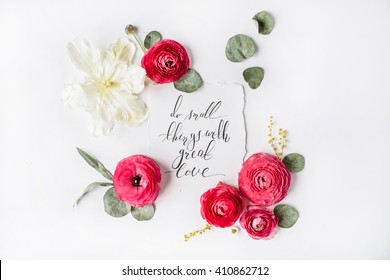 quote "Do small things with great love" written in calligraphy style on paper with pink, red roses, ranunculus,   white tulips and green leaves isolated on white background. Flat lay, top view - Powered by Shutterstock