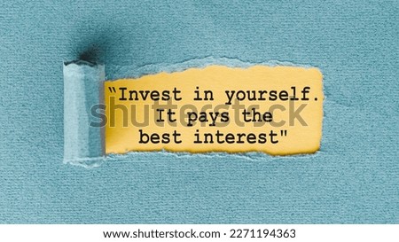 The quote Invest in yourself, it pays the best interest, appearing behind ripped paper.